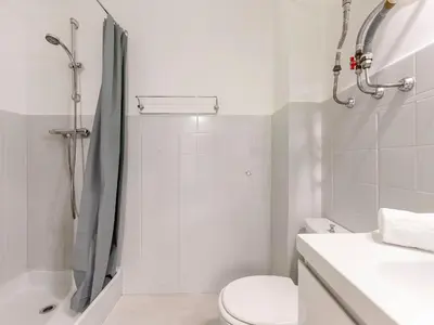 a bathroom with a shower and a toilet and a sink at Apartment Le Marlyne 2-3 by Interhome in Cannes