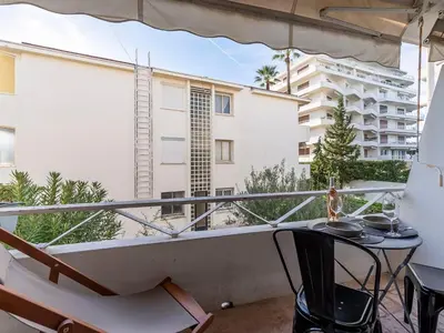a balcony with a table and a view of a building at Apartment Le Marlyne 2-3 by Interhome in Cannes