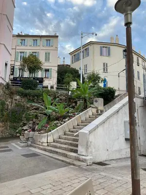 a set of stairs in a city with buildings at Appartement 2bedrooms 3min de Palais des Festivals in Cannes