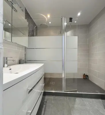 a white bathroom with a sink and a shower at Charming 2 room , 52 m2, very spacious, bright and near sea Martinez hotel in Cannes