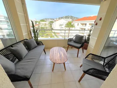 a living room with a couch and chairs on a balcony at Alba DeLuxe - 3 Bedroom Pointe Croisette, by Welcome to Cannes in Cannes