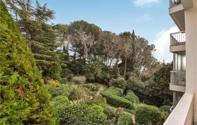 a view of a garden from a building at Beautiful Apartment In Cannes With Wifi in Cannes