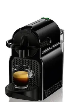 a black coffee maker with a cup of coffee at Appartement Loft ATYPIQUE et ravissant de 60 m2 Nouveau in Cannes