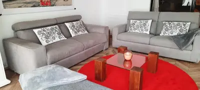 a living room with a couch and a table at Appartement Loft ATYPIQUE et ravissant de 60 m2 Nouveau in Cannes