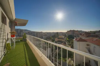 a balcony with a view of a city at IMMOGROOM -Rooftop 150m2 -Terrace 150m2 -Parking -Wifi - AC in Cannes