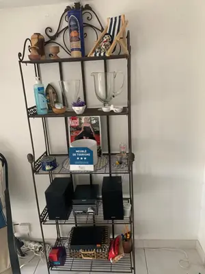 a shelf with bowls and other items on it at STUDIO classé 3 étoiles 10 mn Cannes in Le Cannet