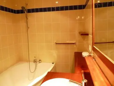 a bathroom with a tub and a toilet and a sink at Stylish one bedroom apartment in Central Cannes just off the Croisette and near beaches - 680 in Cannes