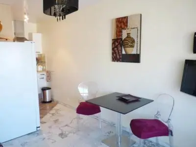 a dining room with a table and two chairs at Stylish one bedroom apartment in Central Cannes just off the Croisette and near beaches - 680 in Cannes