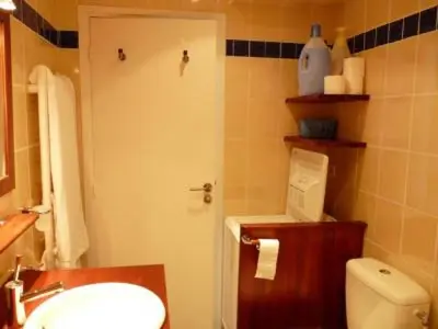 a bathroom with a white toilet and a sink at Stylish one bedroom apartment in Central Cannes just off the Croisette and near beaches - 680 in Cannes