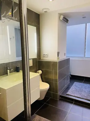 a bathroom with a toilet and a sink at Magnifique Modern appartement avec terrasse FERN12 in Cannes