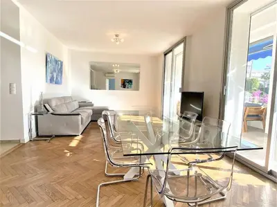 a living room with a glass table and a couch at Viva Riviera Résidence Les Dunes 90 Croisette in Cannes