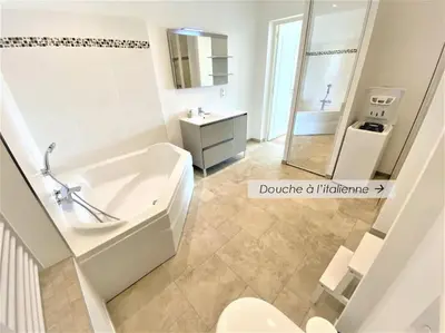 a bathroom with a tub and a toilet and a sink at Viva Riviera Résidence Les Dunes 90 Croisette in Cannes