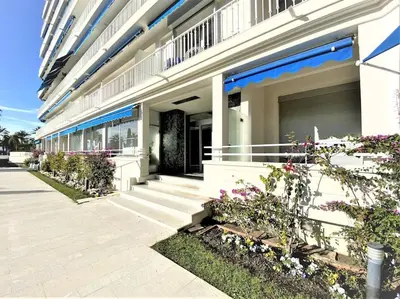 a building with flowers on the side of it at Viva Riviera Résidence Les Dunes 90 Croisette in Cannes