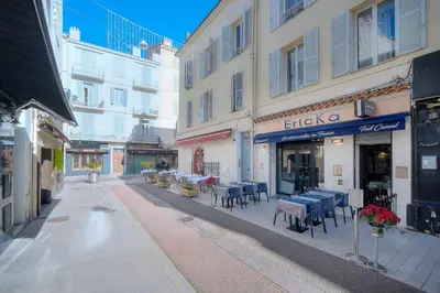 an empty street with tables and chairs and buildings at IMMOGROOM- Apartment 70m2 - Renovated - Wifi - AC - Close to everything in Cannes