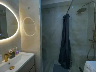 a bathroom with a shower and a sink at Le Trident B in Cannes