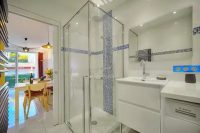 a bathroom with a shower with a sink and a counter at Elégant 2 pièces TERRASSE, CARLTON MARTINEZ- Proche CROISETTE A1B238 in Cannes