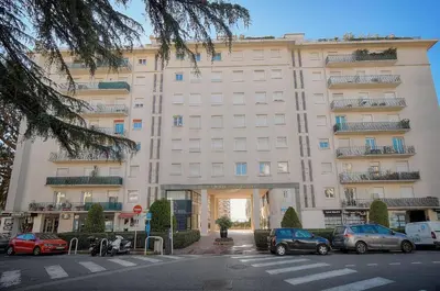 a large white building with cars parked in front of it at Elégant 2 pièces TERRASSE, CARLTON MARTINEZ- Proche CROISETTE A1B238 in Cannes