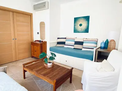 a living room with a bed and a coffee table at Appartement Cannes centre ville pour congrès ou vacances à 5 min de la Croisette, plage in Cannes