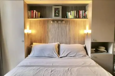 a bed with two white pillows in a bedroom at Appartement Cannes centre ville pour congrès ou vacances à 5 min de la Croisette, plage in Cannes