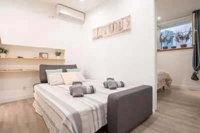 a bedroom with a large bed in a room at Centre Cannes - 5 Mins Des Plages Et Du Palais ! - Joseph Méro in Cannes