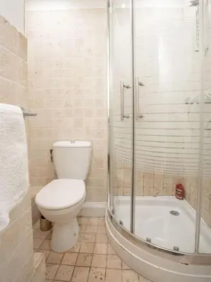 a bathroom with a toilet and a glass shower at Centre Cannes - 5 Mins Des Plages Et Du Palais ! - Joseph Méro in Cannes