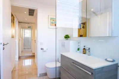 a white bathroom with a sink and a toilet at 2-Br in high Residential Property in Cannes