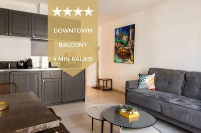 a living room with a couch and a table at 1-Br apartment in the heart of Cannes in Cannes