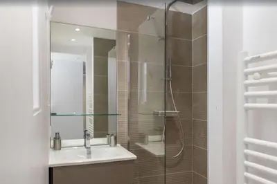 a bathroom with a sink and a glass shower at FRGK Contemporary Luxury Villa Panoramic Sea View, Pool & Ultra-Fast Wi-Fi in Cannes