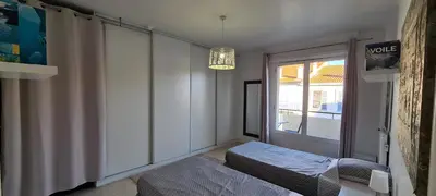 a small room with two beds and a window at CENTRE, 3P/TERRASSE , 300 m PLAGES. in Cannes