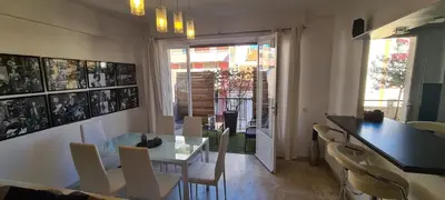 a dining room with a table and chairs at CENTRE, 3P/TERRASSE , 300 m PLAGES. in Cannes
