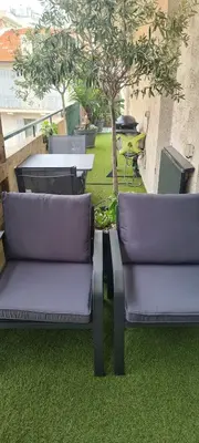 two purple chairs and a table and a tree at CENTRE, 3P/TERRASSE , 300 m PLAGES. in Cannes