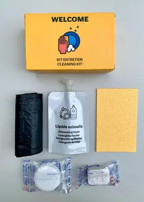 a box with a bottle of water and other items at Citybeach SOHA- Rue d'Antibes - 2 BdR 2 BthR 1 toil - Clim Terrace Parking Elevator in Cannes