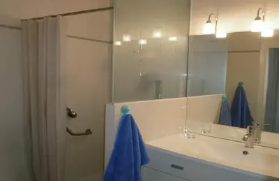 a bathroom with a sink and a shower with a mirror at VILLAS DES LYS in Cannes