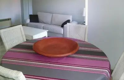 a living room with a table with a bowl on it at VILLAS DES LYS in Cannes