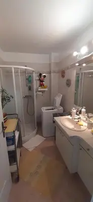 a bathroom with a shower and a sink and a toilet at Appartement vue mer panoramique, plage 150M, terrasse, parking privé, clim in Cannes