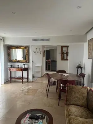a small room with a bed and a kitchen at Résidence Cannes in Cannes