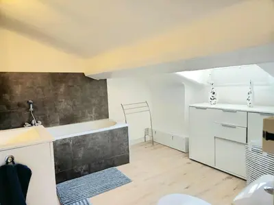 a kitchen with a sink and a counter top at Palais des festivals et rue d'Antibes charme mansardes in Cannes