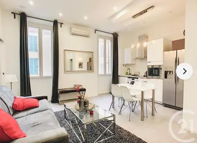 a living room with a couch and a table at 1 Bedroom flat 4ppl Cannes Center Croisette Banane in Cannes