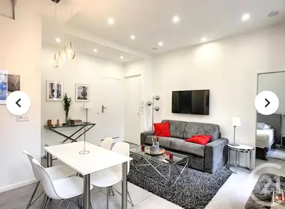 a living room with a couch and a table at 1 Bedroom flat 4ppl Cannes Center Croisette Banane in Cannes