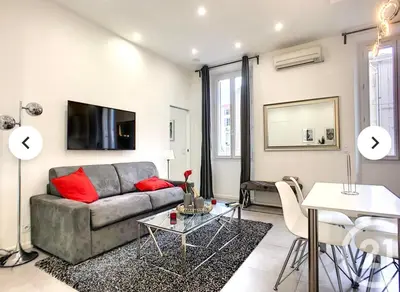a living room with a couch and a table at 1 Bedroom flat 4ppl Cannes Center Croisette Banane in Cannes
