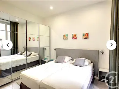 a bedroom with two beds and a mirror at 1 Bedroom flat 4ppl Cannes Center Croisette Banane in Cannes
