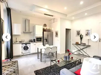 a kitchen and living room with a table and chairs at 1 Bedroom flat 4ppl Cannes Center Croisette Banane in Cannes