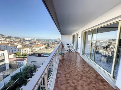 a balcony with a view of a city at SUQ3 - Très beau 2 pièces avec terrasse in Cannes