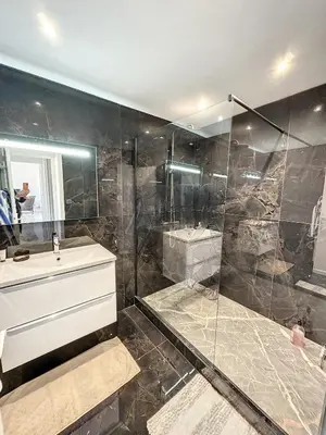 a bathroom with a shower and a sink and a tub at SUQ3 - Très beau 2 pièces avec terrasse in Cannes
