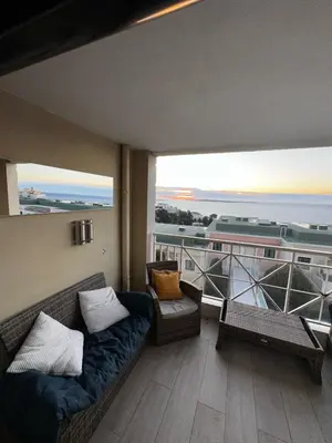 a living room with a couch and a balcony at CANNES VILLA FRANCIA in Cannes