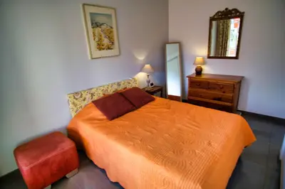 a bedroom with a bed and a dresser and a mirror at Ref JUAS - Palmes d'Or Properties in Cannes