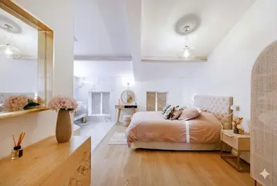 a bedroom with a bed in a white room at Candy in Cannes