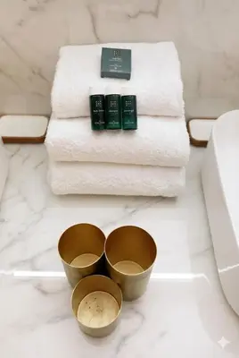 a bathroom with two bowls and towels on a counter at Candy in Cannes