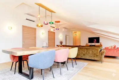 a dining room with a table and chairs and a couch at Candy in Cannes