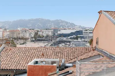 a view of a city from the roofs of buildings at Pegase in Cannes